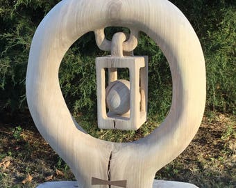Ball in cage wood sculpture