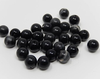 Lot de vingt neuf perles de verre noir ,diamètre environ 1 cm ,livraison gratuite