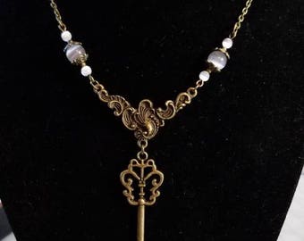 16 1/2" Skeleton Key pendant necklace with White and Grey Cat Eye beads