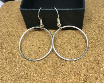 Sterling silver dangling hoop earrings
