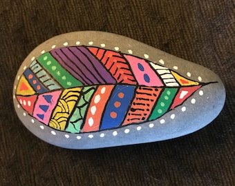 Feather painted rock