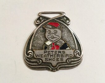 Advertising Watch Fob for Peter's Weatherbird Shoes, St. Louis, Mo, Ca: 1920s.