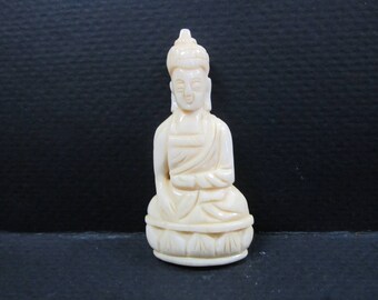 Buddha hand carved bone pendant