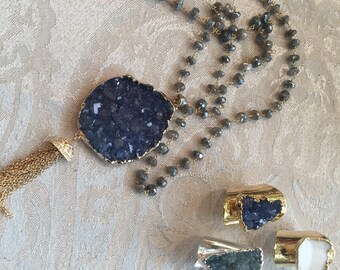 Beautiful blue druzy geode plated in 24K gold with a tassel on a labradorite beaded chain