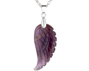 angel with wings holding blue amethyst pendant