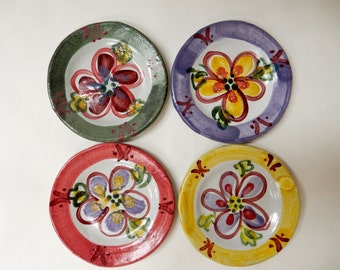 4 appetizer plates painted with flowers which I call garden graffiti….painted with lime green….red….purple…dark green…*