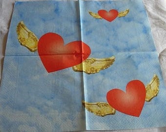 Red hearts on blue paper towel