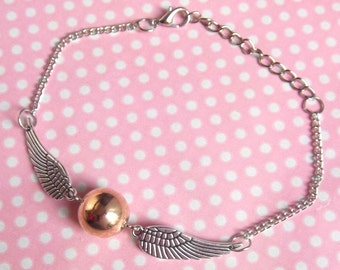 Winged golden ball bracelet