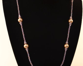 Handmade beaded necklace with purple focal bead