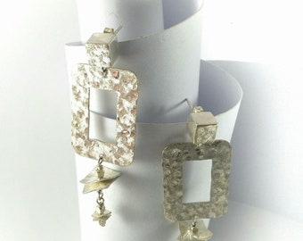 Hammered silver earrings, voluminous, light, geometrical, luminous, Italian design, single piece, handmade.