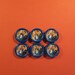 Vintage set of five Versace buttons.