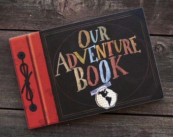 Ellie Badge with "OUR" Adventure Book