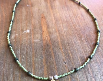 Green and gold star pendant necklace