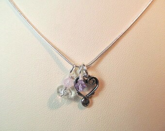 Charm necklace, heart shaped charm with crystals and glass bead