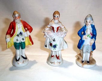 Three Hand Painted Porcelain Made in Japan Figurines - One Occupied Japan and a Pair of Colonial Man and Woman Marked JAPAN