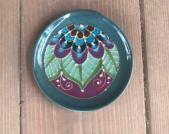 Wheel thrown and slip trailed spoon rest