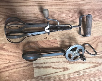 Two antique hand mixers