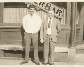 Vintage Snapshot "Proud Owners" Men Standing In Front Of Bar Restaurant Bartender Found Vernacular Photo