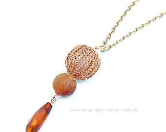 copper wire crochet pendant with carnelian elements