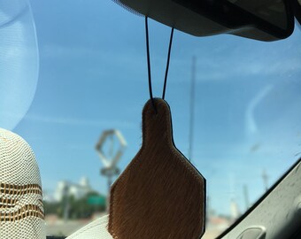 cowhide and leather car freshener with 1oz bottle of scented oil