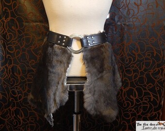Fur tasset with engraved leather belt and large ring. Medieval, reenactment costume.