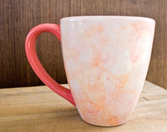 Bright orange and pink bubble glazed ceramic mug