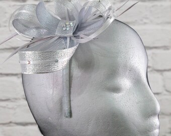Metallic silver fascinator with sparkling diamante' on a comb, Alice band or clip.