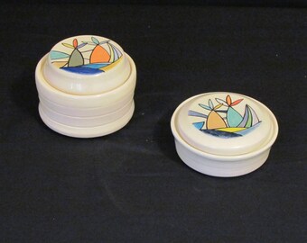 Mini bowls with trees on the beach.