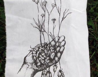 little roots back patch -- wild yampah roots and flowers held in our hands silkscreened orgininal drawing by amara hollow bones