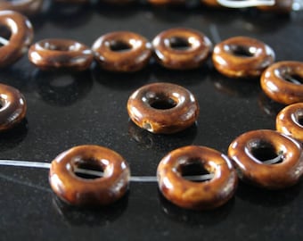 set of 4 Brown porcelain discs. (ref:2100).