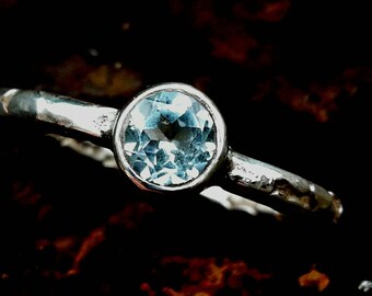 Sky Blue Topaz set in etched silver ring.