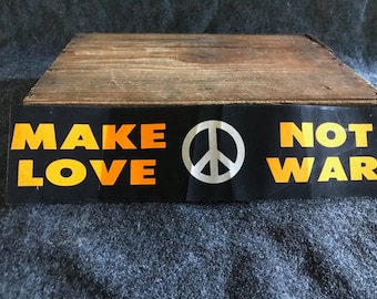 Vintage fluorescent Make Love Not War bumper sticker