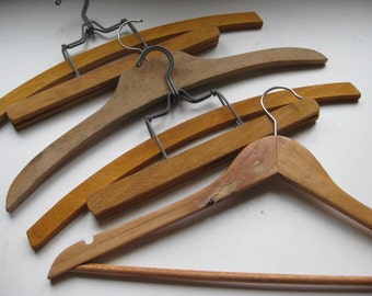 Set of 4 vintage French wooden clothes hangers.