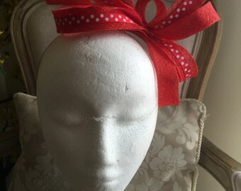 Sophisticated red fascinator loop with feathers on a silver headband!