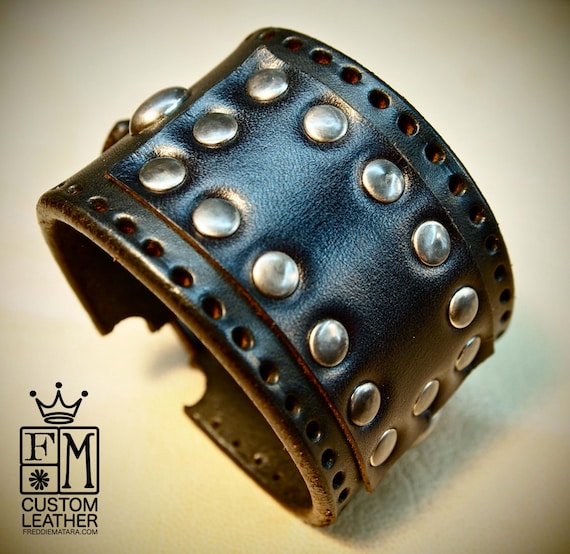 Black bridle leather cuff studded with antique nickel hardware