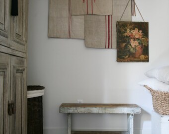 three antique grain sacks