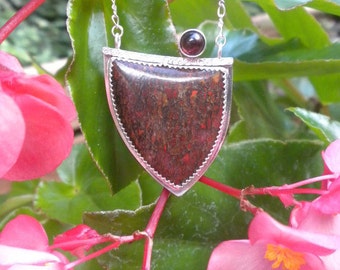 Fossilized Dinosaur Bone Pendant with Garnet