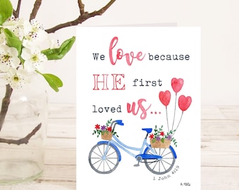 We love because He first loved us (1 John 4:19) Christian Bible verse greetings card with bicycle for wedding, anniversary, engagement