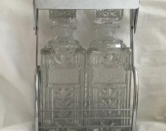 Waterford double decanter set in carry case with retractable handle