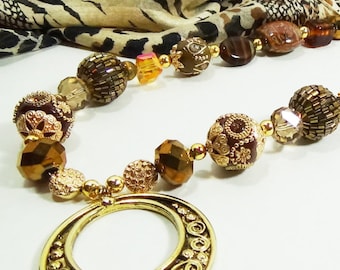 Jesse James beads with opulent browns and golds.