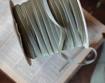 11 yard roll of sage greige 3/8" wide velvet ribbon