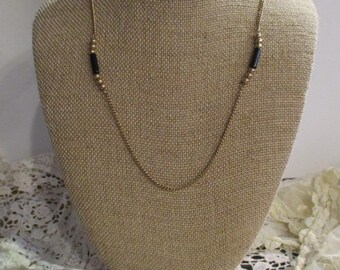 Gold and Black AVON necklace