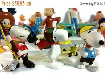 Lot of 21 toys Snoopy Curious George Berenstain Bears Smurfs Disney Cabbage Patch Wizard of Oz Scooby Doo Donkey Kong Racing Champions Car