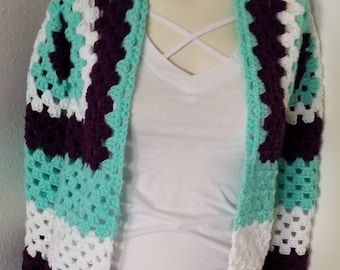 Purple, Mint, and White cardigan sweater with long sleeves.