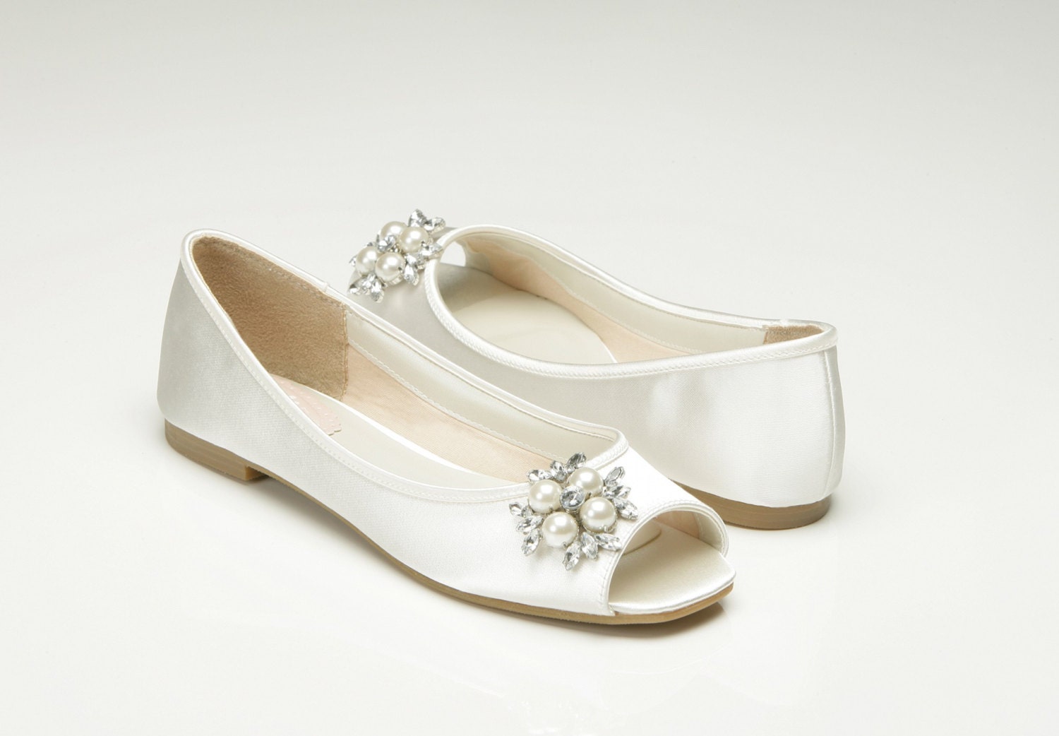 This lovely shoe offered by Pink2Blue is a beautiful peep toe flat bridal shoe. If you are looking for both style and comfort