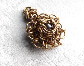 Unique brass pendant and purified and energized hematite.