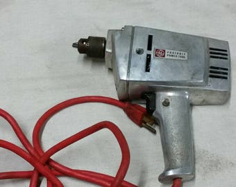 Vintage electric power drill.General Electric portable power tool 25TM-1 tool head 1/4 inch drill