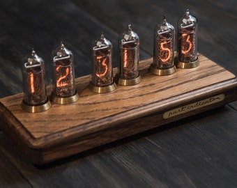 Nixie tube clock in oak and brass case