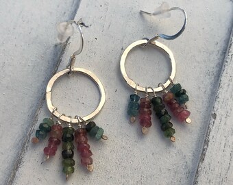 Hand forged sterling silver hoops with watermelon tourmaline.