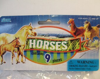 Plastic toy horses in original unopened package 9 pc horses with saddles 4 years and up